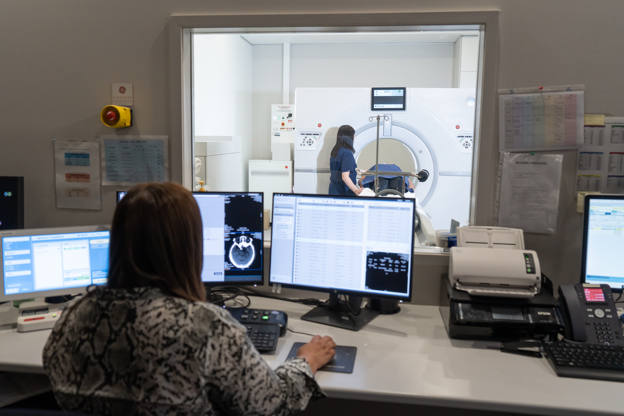 Woman Checking on Laboratory Results on a Computer Screen | Medical Imaging Experts | FMIG