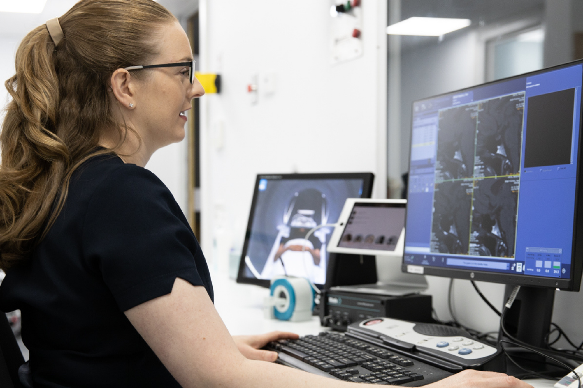 Woman Staring at Computer Screen | Medical Imaging Services | FMIG