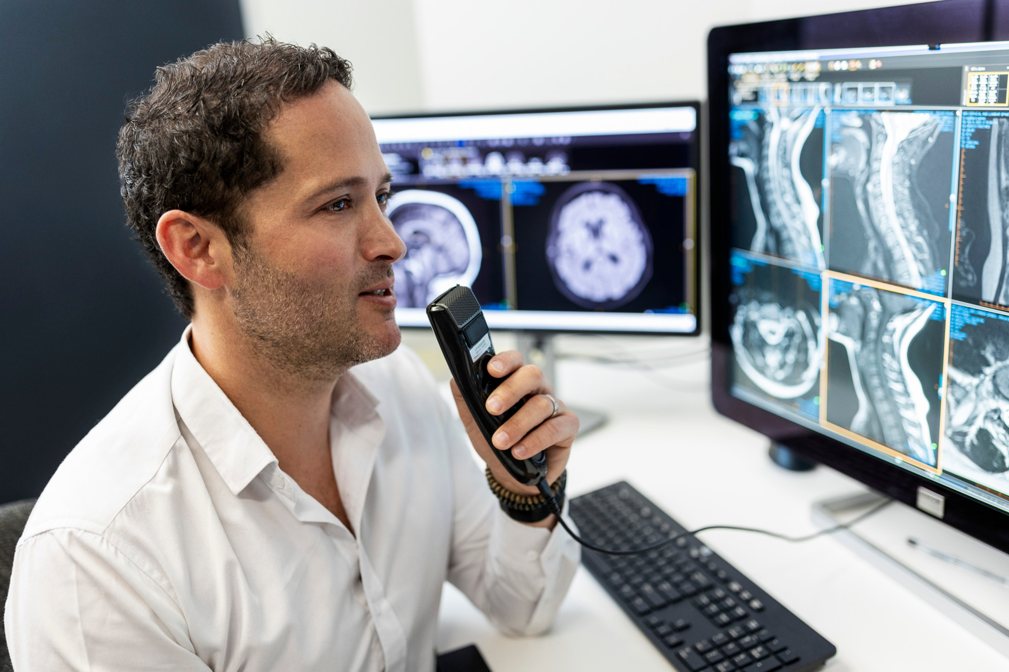 Male Radiologist Speaking Into the Dictation Recorder | Medical Imaging Experts | FMIG